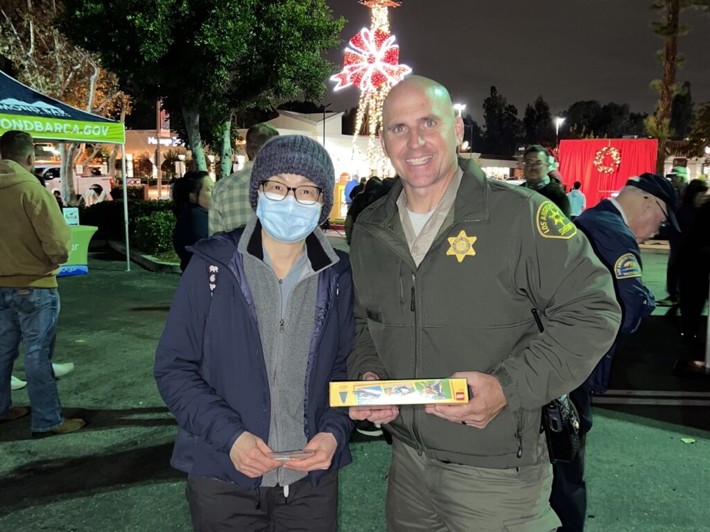 Someone shows up with toys to donate to the Pack a Patrol Car Program for kids